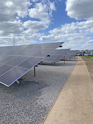 Image of solar panels running alongside a path