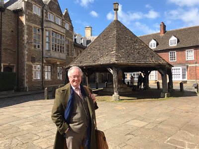 Commissioner with Oakham Buttercross in the background